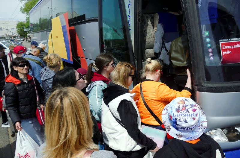 Refugees from southeastern Ukraine, who are preparing to travel to the Palanca checkpoint to cross into Moldova en route to Germany, gather in Odesa