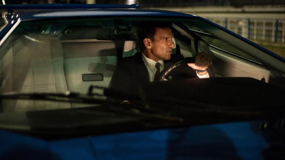 Ferruccio Lamborghini (Frank Grillo) is pensive as he drives one of the company's signature cars, the spaceship-like Countach. The car, built in the 1980, remains a collector's item and iconic machine.