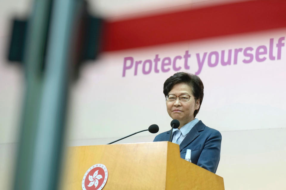 Hong Kong Chief Executive Carrie Lam listens to reporters' questions during a press conference in Hong Kong, Tuesday, May 25, 2021. Lam on Tuesday defended Hong Kong as an attractive place for businesses, after a recent survey found many foreigners were considering leaving the longtime Asian business hub. (AP Photo/Vincent Yu)