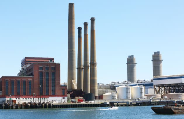 The Mystic Generating Station, located just outside Boston, burns natural gas and petroleum, which contribute to climate change and produce local air pollution that neighboring communities blamed in 2020 for making COVID-19 worse. (Photo: Boston Globe via Getty Images)
