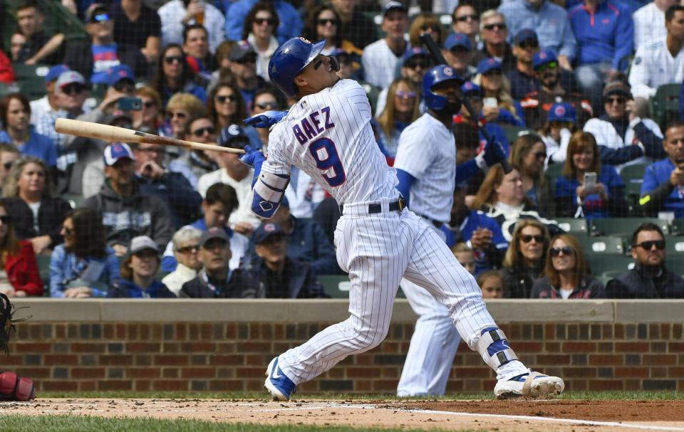 Chicago Cubs' Javier Baez (9) watches his double during the first inning of a baseball game against the St. Louis Cardinals on Saturday, Sept. 29, 2018, in Chicago. (AP Photo/Matt Marton)