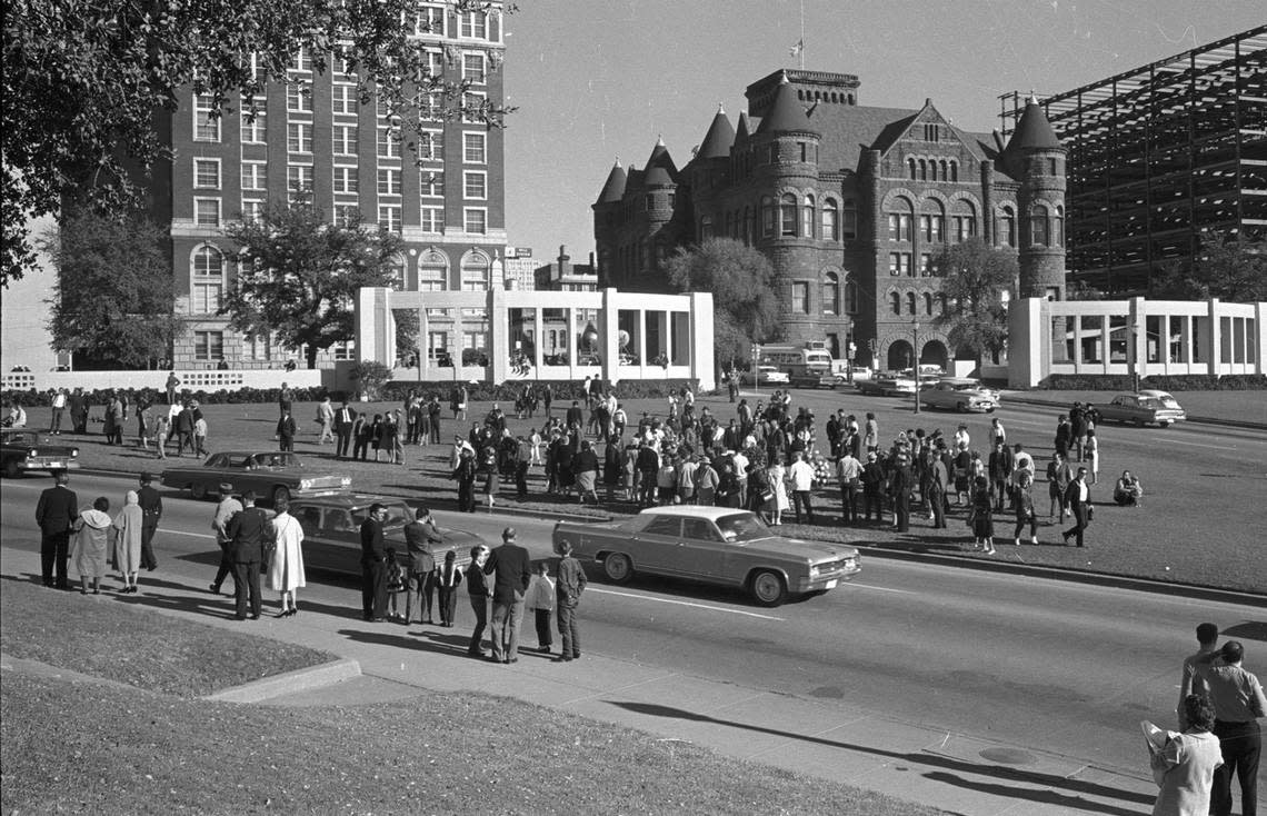 Nov. 22, 1963: People waiting on grassy knoll, Dealey Plaza, on morning of President John F. Kennedy assassination.