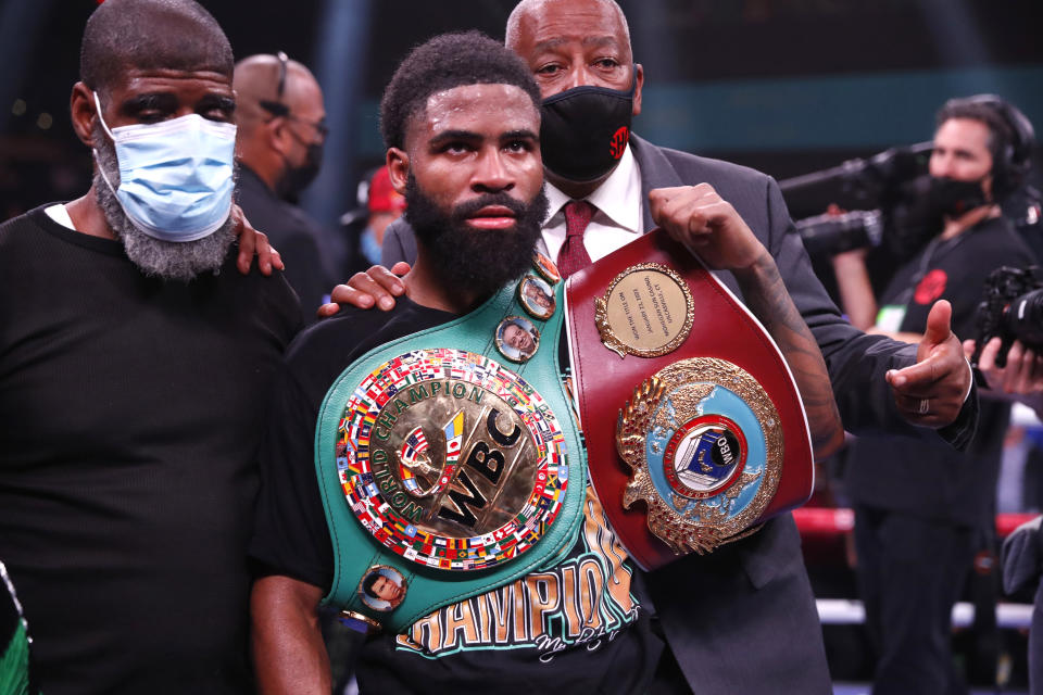 LAS VEGAS, NEVADA - NOVEMBER 27: WBO champion Stephen Fulton Jr. poses with his belts after defeating WBC champion Brandon Figueroa in a super bantamweight title unification fight at the Dolby Live at Park MGM theater on November 27, 2021 in Las Vegas, Nevada. (Photo by Steve Marcus/Getty Images)