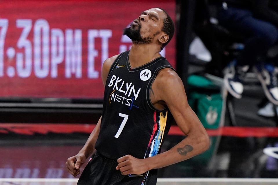 Brooklyn Nets forward Kevin Durant reacts after sinking a 3-point shot against the Milwaukee Bucks during the fourth quarter of Game 5 of a second-round NBA basketball playoff series on June 15, 2021, in New York.