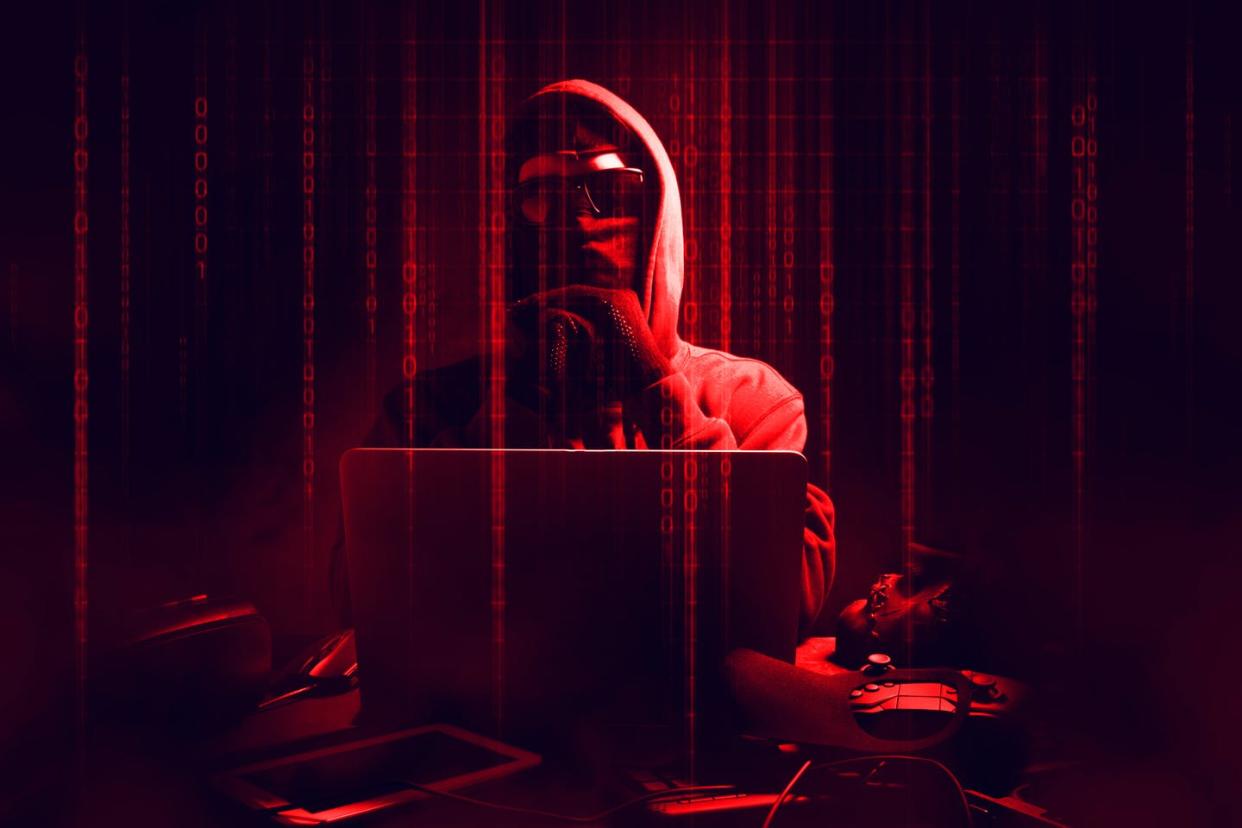 <span class="caption">Cybercriminals view colleges as high-value targets. </span> <span class="attribution"><a class="link " href="https://www.gettyimages.com/detail/photo/digital-composite-image-of-male-hacker-using-laptop-royalty-free-image/1191871809?adppopup=true" rel="nofollow noopener" target="_blank" data-ylk="slk:Issaro Prakalung / EyeEm/GettyImages;elm:context_link;itc:0;sec:content-canvas">Issaro Prakalung / EyeEm/GettyImages</a></span>