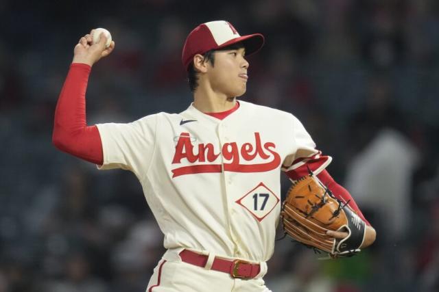 Japanese Shohei Ohtani throws a ball in the first inning during