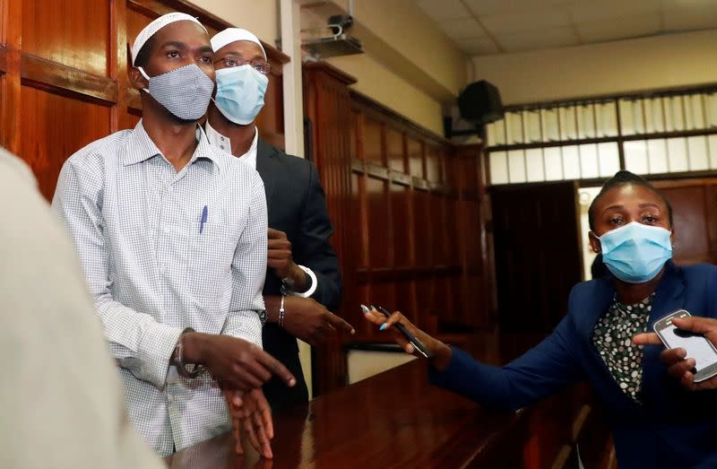 Hussein Hassan and Mohamed Ahmed, suspects charged with helping al Qaeda-linked militants to launch an attack on the Westgate mall, leave the dock before being sentenced, at the Milimani Law Courts in Nairobi