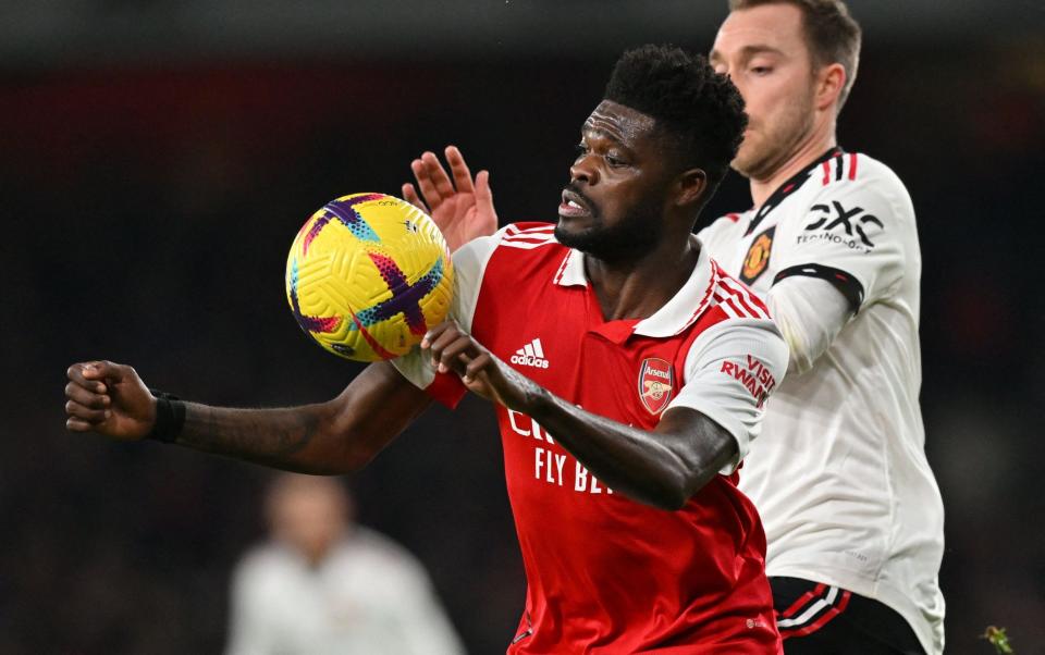 Thomas Partey vies for the ball with Christian Eriksen - Glyn Kirk/AFP