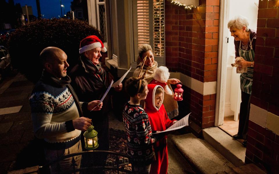 Family Carol Singing - DGLimages/iStockphoto