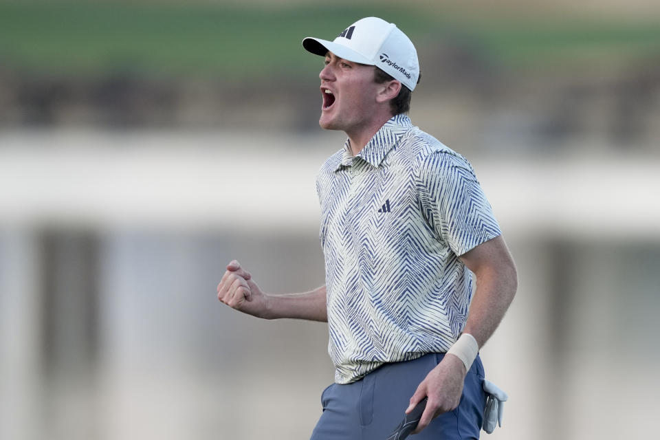 Nick Dunlap reacts after making his putt on the 18th hole of the Pete Dye Stadium Course during the final round to win the American Express golf tournament, Sunday, Jan. 21, 2024, in La Quinta, Calif. (AP Photo/Ryan Sun)