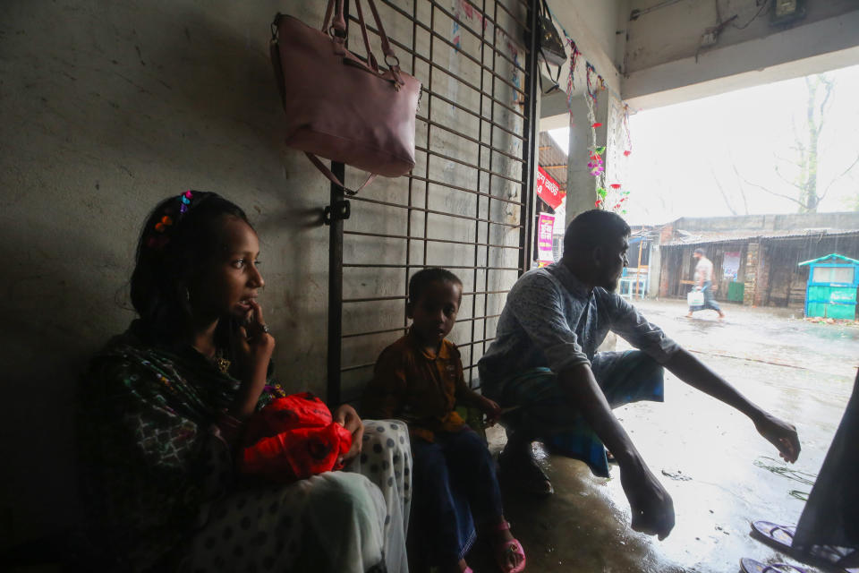 People who were evacuated watch the rains from inside a shelter after Cyclone Remal lashed Bangladesh’s southern coast in Shyamnagar, Satkhira District, Bangladesh, Monday, May 27, 2024. (AP Photo/Abdul Goni)