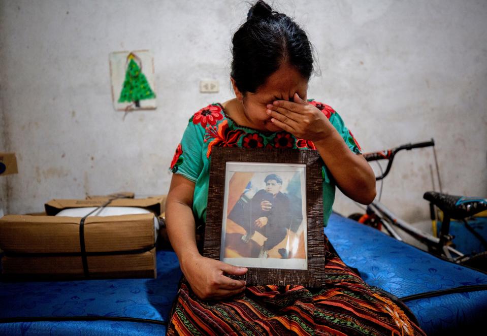 Magdalena Tziquin Cuc, holds a photo of her son Gaspar Josué Cuc Tziquin, who died in a March 27, 2023, fire in an immigration detention center in Juárez, Mexico.