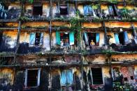 'Survivors' by GMB Akash in Bangladesh. The decrepit building houses 80 families of sweepers, the lowest in the caste system and regarded as 'untouchables'. This picture is one of many entries for this year's Environmental Photographer of the Year Award, run by The Chartered Institution of Water and Environmental Management. The competition aims to showcase the best images depicting environmental and social issues. The thought-provoking and beautiful images will be displayed at the Royal Geographical Society from April 10 (GMB Akash)