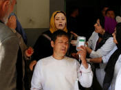 Relatives react around an injured man in a hospital after a blast in Kabul, Afghanistan March 21, 2018. REUTERS/Mohammad Ismail