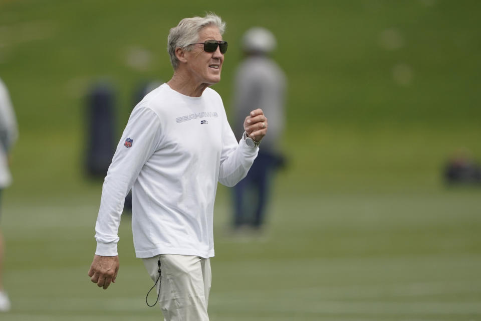 Seattle Seahawks coach Pete Carroll walks on the field during NFL football practice Tuesday, June 7, 2022, in Renton, Wash. (AP Photo/Ted S. Warren)