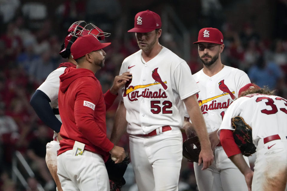 St. Louis Cardinals starting pitcher Matthew Liberatore (52) is removed by manager Oliver Marmol, left, during the sixth inning of a baseball game against the Milwaukee Brewers Wednesday, May 17, 2023, in St. Louis. (AP Photo/Jeff Roberson)