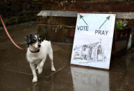 <p>Skye the dog waits outside a polling station in St James’ Church, Edinburgh as voters head to the polls across the UK to vote in the General Election. (Photo: Jane Barlow/Getty Images) </p>