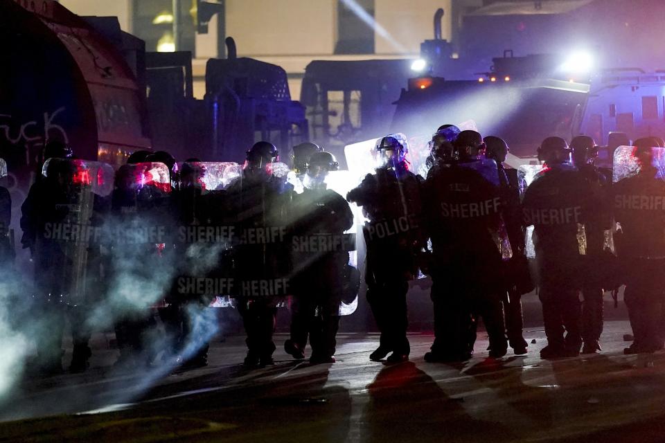 Authorities disperse protesters out of a park Tuesday, Aug. 25, 2020 in Kenosha, Wis. Anger over the Sunday shooting of Jacob Blake, a Black man, by police spilled into the streets for a third night. (AP Photo/Morry Gash)