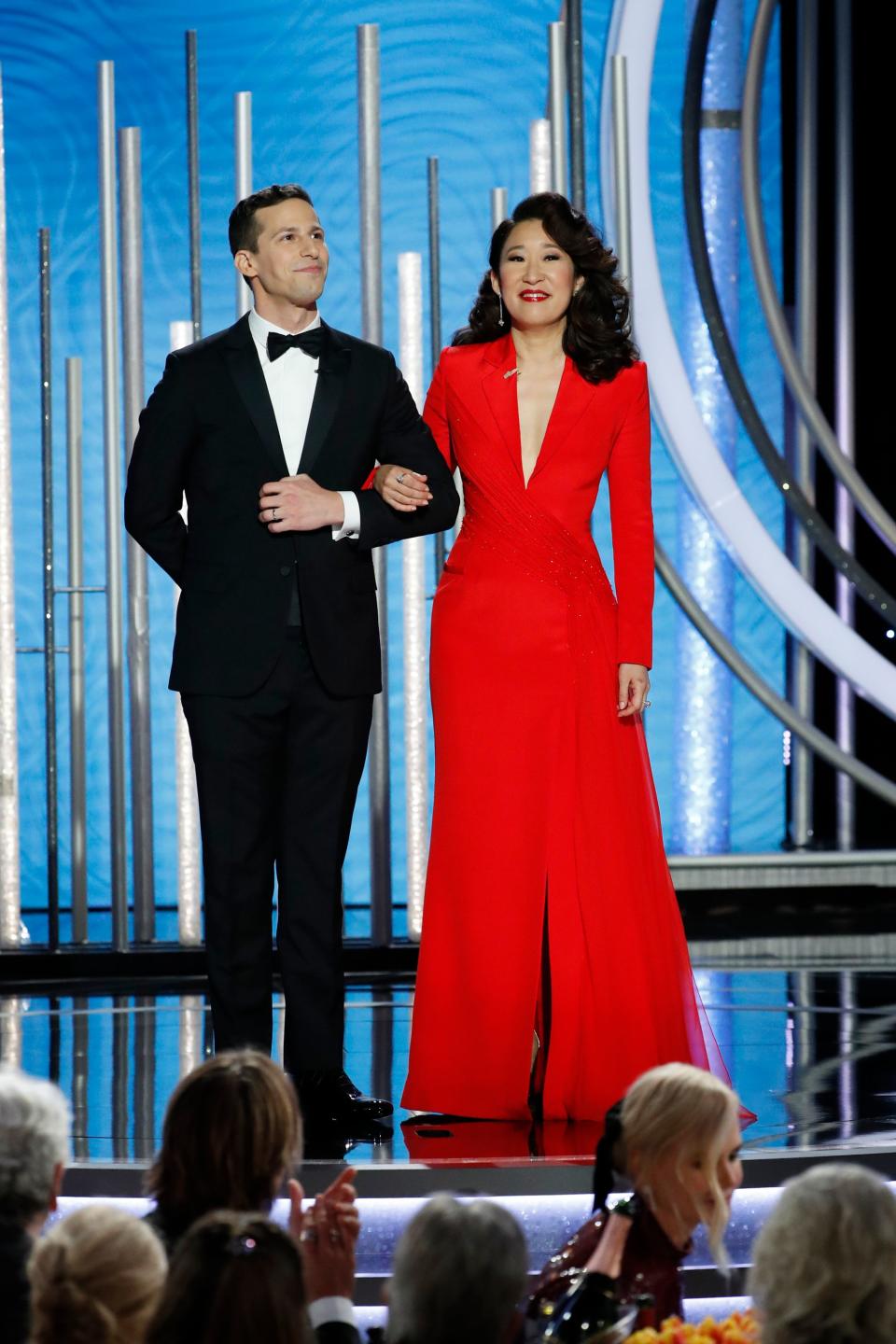 Hosts Andy Samberg and Sandra Oh  speak onstage during the 76th Annual Golden Globe Awards.