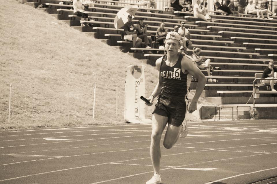 Reading junior Tyler Bays runs in the 4x400-meter relay