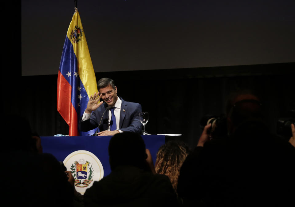 Venezuelan opposition leader Leopoldo Lopez waves during a news conference in Madrid on Tuesday, Oct. 27, 2020. Prominent opposition activist Leopoldo López who has abandoned the Spanish ambassador's residence in Caracas and left Venezuela after years of frustrated efforts to oust the nation's socialist president is holding a news conference in Madrid. (AP Photo/Andrea Comas)