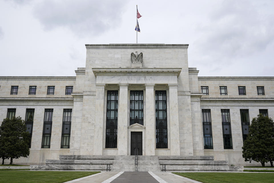 FILE - This May 4, 2021, file photo shows the Federal Reserve building in Washington. The Federal Reserve is poised this week to begin unleashing its most drastic steps in three decades to attack inflation by making it costlier to borrow — for a car, a home, a business deal, a credit card purchase — all of which will compound Americans' financial strains and likely weaken the economy. The Fed is expected to announce Wednesday, May 3, 2022 that it will begin quickly shrinking its vast stockpile of Treasury and mortgage bonds beginning in June — a move that will have the effect of further tightening credit. (AP Photo/Patrick Semansky, File)