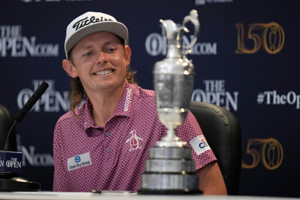 Cameron Smith looks at the claret jug trophy after winning the British Open on the Old Course at St. Andrews, Scotland.