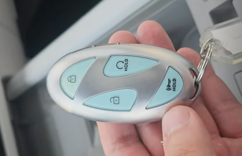 The new Hyundai key fob with ice blue buttons and a Hyundai H separating them.