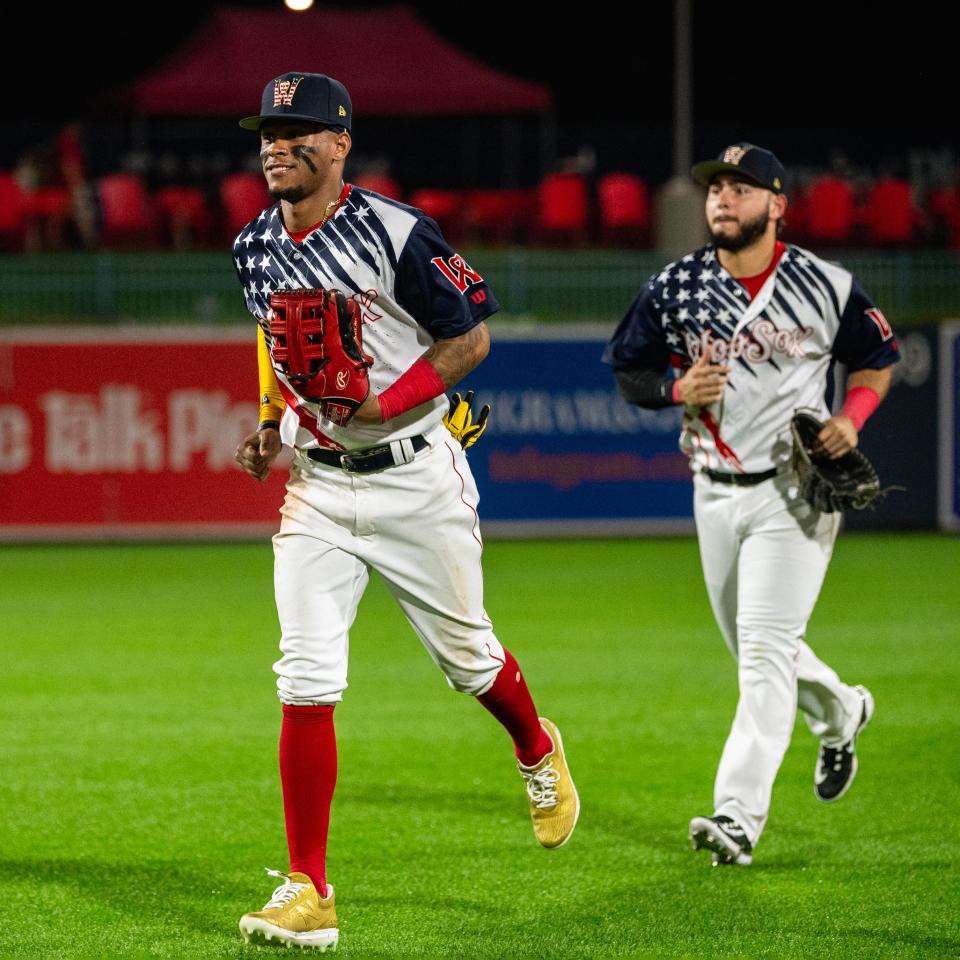 Ceddanne Rafaela makes his win in to greet his teammates following the WooSox' 8-5 win on July 4, 2023, at Polar Park.