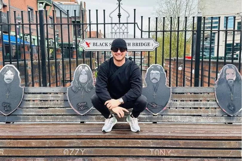 Michael Bublé posing on the Black Sabbath Bridge