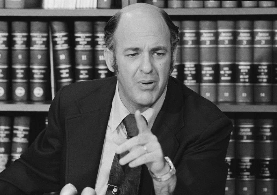 FILE - Dr. Cyril Wecht, coroner for Allegheny County, Pa., tells reporters that the Rockefeller CIA Commission report on his findings in the John F. Kennedy assassination case have been distorted, June 12, 1975, in Washington. Wecht, a pathologist and attorney whose biting cynicism and controversial positions on high-profile deaths such as President John F. Kennedy’s 1963 assassination caught the attention of prosecutors and TV viewers alike, died Monday, May 13, 2024. He was 93. (AP Photo/Charles Bennett, File)