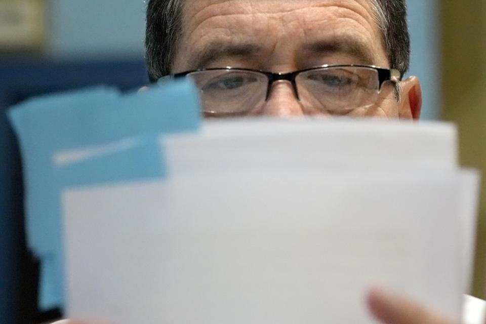 Chicago mayoral candidate Rep., Jesus "Chuy" Garcia, D-Ill., and looks over some papers during lunch at Punta Cana restaurant Wednesday, Feb. 22, 2023, in Chicago. Garcia, who continues to seek the mayor's office, forced then-Mayor Rahm Emanuel to a runoff in 2015. (AP Photo/Charles Rex Arbogast)