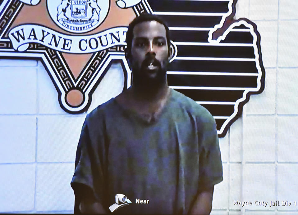 Deangelo Martin is displayed on a monitor during his video arraignment at 36th District Court, Wednesday, Sept. 18, 2019, in Detroit. Martin is charged with four counts of first-degree murder and four counts of felony murder in the killings of four women whose bodies were found in abandoned houses in the city as far back as February 2018. Martin, who was arrested in June, was already charged in the stabbing and sexual assault of 26-year-old woman in May and the kidnapping and assault of a 51-year-old woman in June. (Clarence Tabb, Jr./Detroit News via AP)