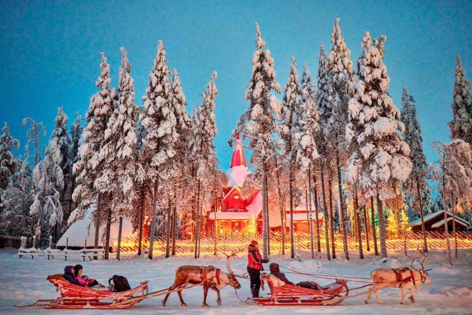 <p>Mark Waugh/Alamy</p> Reindeer sleds at Santa Claus Village, near the town of Rovaniemi.