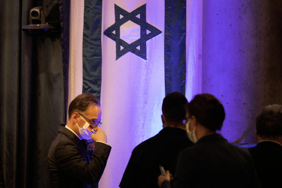 German Foreign Minister Heiko Maas, leave the stage after a joint statement to the media with his Israeli counterpart Gabi Ashkenazi in Jerusalem, Wednesday, June 10, 2020. (AP Photo/Oded Balilty)