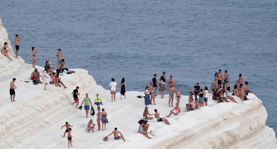 Sicilians tried to escape the heat yesterday, on the coast of Realmonte, near Porto Empedocle. Source: AP / AAP