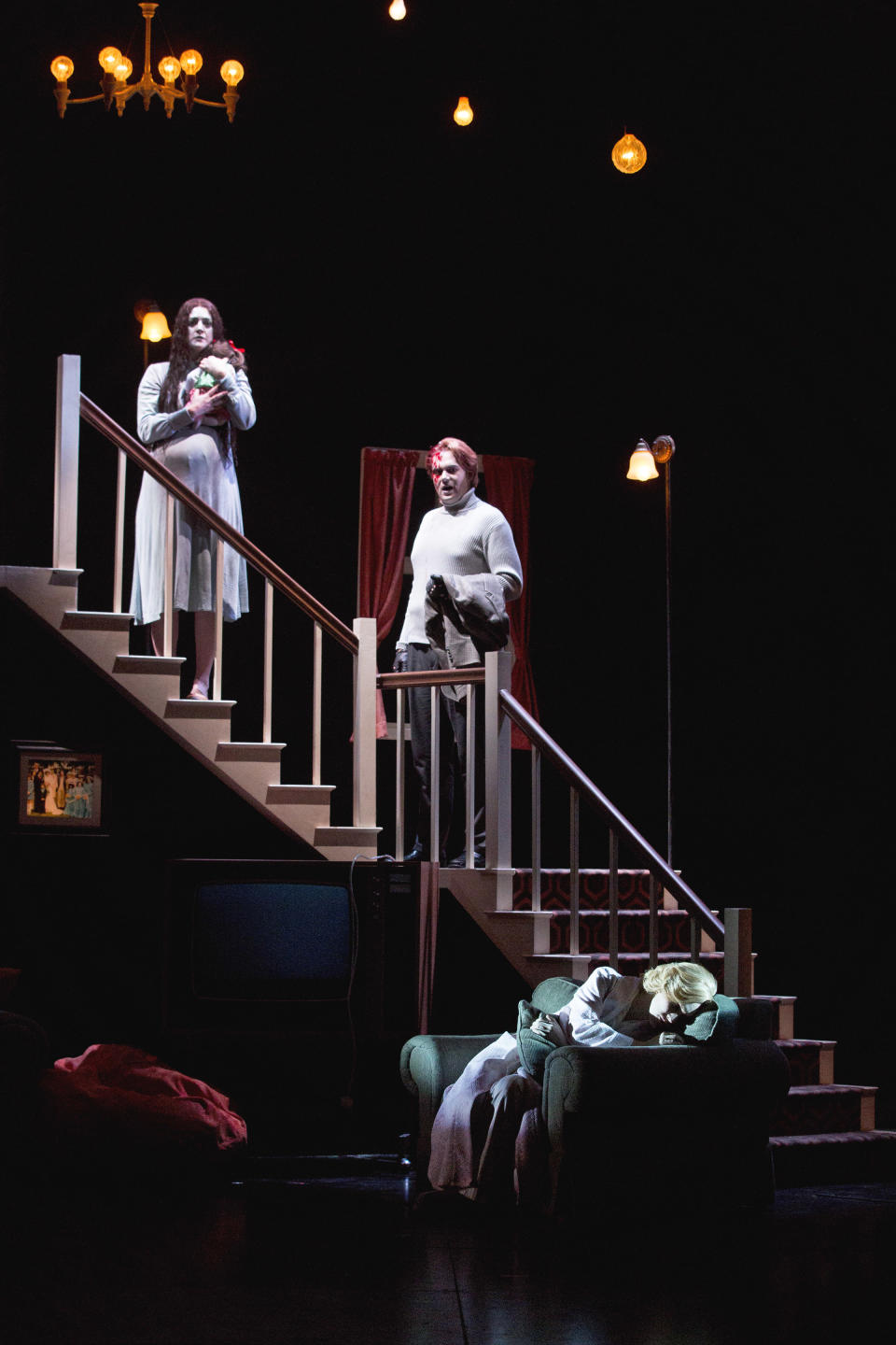 In this Feb. 22, 2013 photo provided by the New York City Opera, cast members perform during a dress rehearsal of “The Turn of the Screw,” by the New York City Opera at the Brooklyn Academy of Music in New York. From left are Jennifer Goode Cooper as Miss Jessel; Dominic Armstrong as Peter Quint and Sara Jakubiak as the Governess. (AP Photo/New York City Opera, Richard Termine)