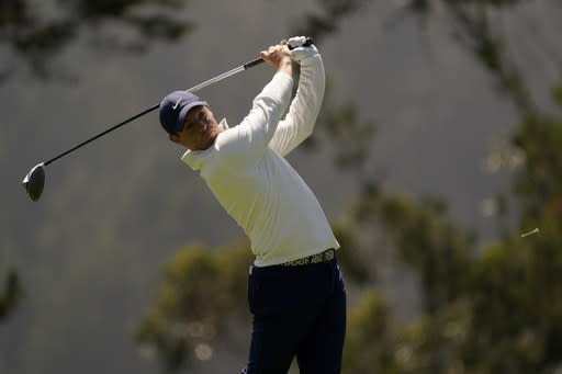 Rory McIlroy of Northern Ireland, watches his tee shot on the fourth hole during the second round of the PGA Championship golf tournament at TPC Harding Park Friday, Aug. 7, 2020, in San Francisco. (AP Photo/Jeff Chiu)