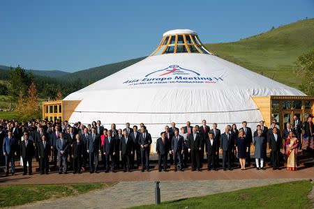 Leaders and head of delegations pose for a family photo during the Asia-Europe Meeting (ASEM) summit just outside Ulaanbaatar, Mongolia, July 16, 2016. REUTERS/Damir Sagolj