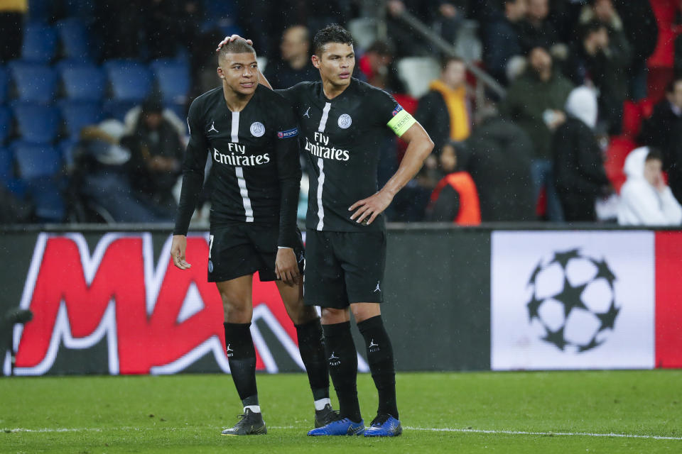 PARIS, FRANCE - MARCH 06: Kylian Mbappe #7 and Thiago Silva #2 of Paris Saint-Germain are upset after the loss of the UEFA Champions League Round of 16 Second Leg match between Paris Saint-Germain and Manchester United at Parc des Princes on March 6, 2019 in Paris, . (Photo by Catherine Steenkeste/Getty Images)