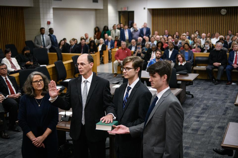 Newly elected Superior Court judge Robby Hicks stands with his family as he is sworn in during his investiture ceremony at the Cumberland County Courthouse on Thursday, Jan. 5, 2023.
