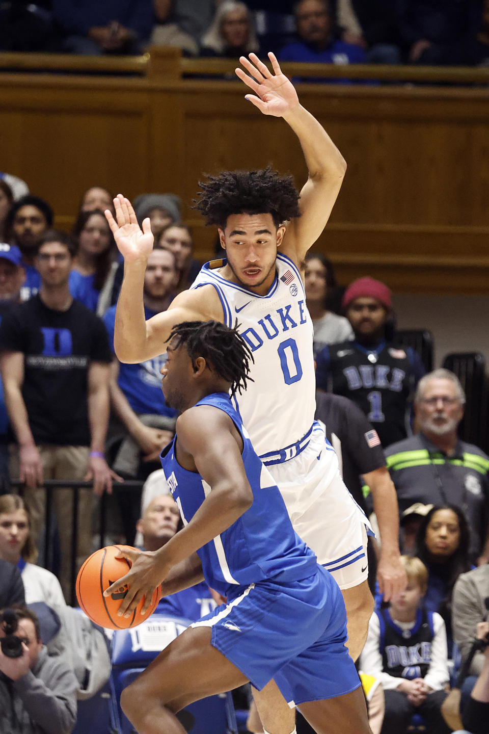 Hofstra's Tyler Thomas, left, drives the ball around Duke's Jared McCain (0) during the first half of an NCAA college basketball game in Durham, N.C., Tuesday, Dec. 12, 2023. (AP Photo/Karl B DeBlaker)