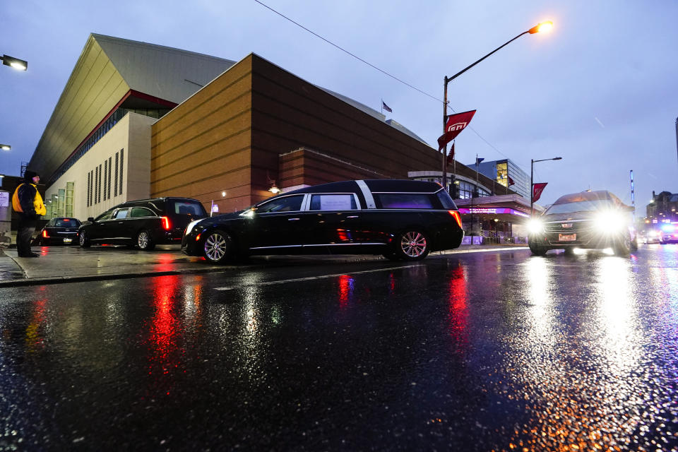 The funeral procession for the victims of a deadly row house fire arrive for services at Temple University in Philadelphia, Monday, Jan. 17, 2022. Officials say it's the city's deadliest single fire in at least a century. (AP Photo/Matt Rourke)