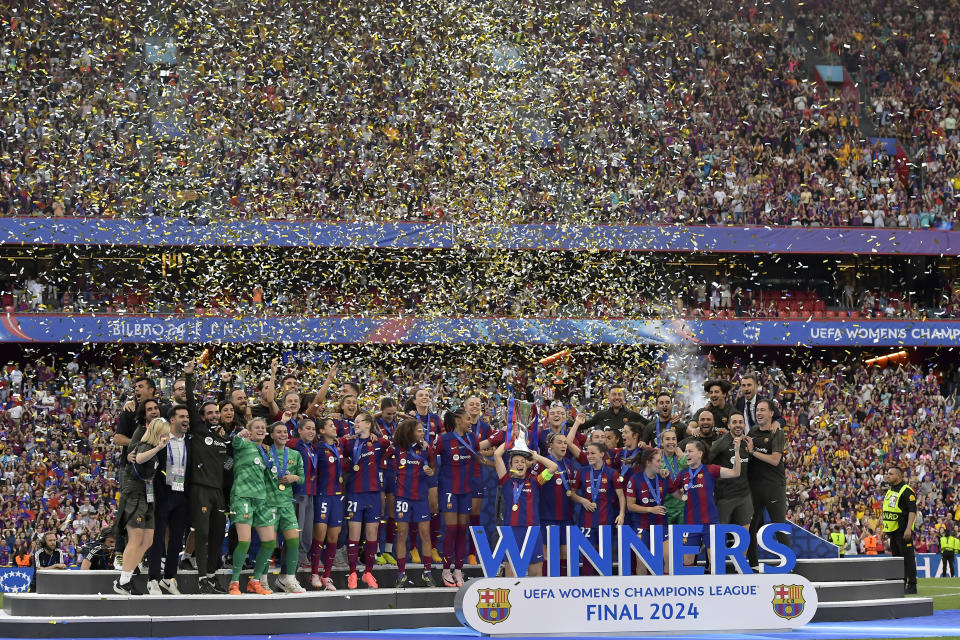 Barcelona's team captain Alexia Putellas lifts the trophy after winning the women's Champions League final soccer match between FC Barcelona and Olympique Lyonnais at the San Mames stadium in Bilbao, Spain, Saturday, May 25, 2024. Barcelona won 2-0. (AP Photo/Alvaro Barrientos)