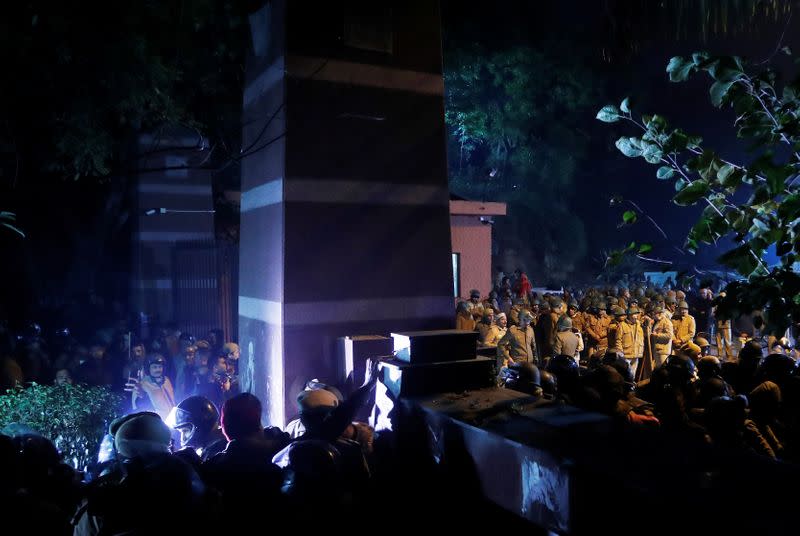 Police in riot gear stand guard inside the Jawaharlal Nehru University (JNU) after clashes between students in New Delhi