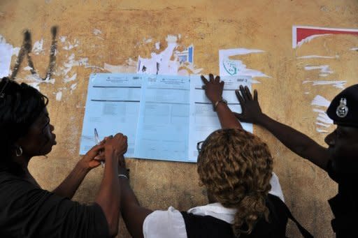 Electoral officers post local election results at a polling station in Freetown, a day after voting in the presidential, parliamentary and local elections. Sierra Leone political parties urged calm on Sunday as the nation braced for results after a peaceful day of voting in polls seen as a litmus test of the west African nation's post-war recovery