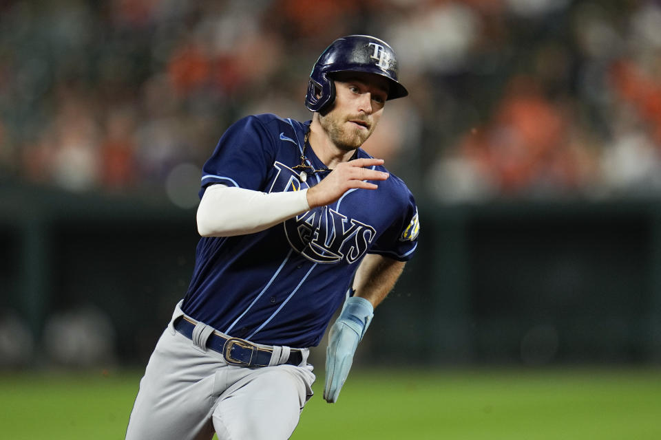 Tampa Bay Rays' Brandon Lowe runs the bases while scoring from first base on a two-run triple by Randy Arozarena off Baltimore Orioles starting pitcher Kyle Bradish in the third inning of a baseball game, Thursday, Sept. 14, 2023, in Baltimore. Rays' Yandy Diaz also scored on the triple. (AP Photo/Julio Cortez)