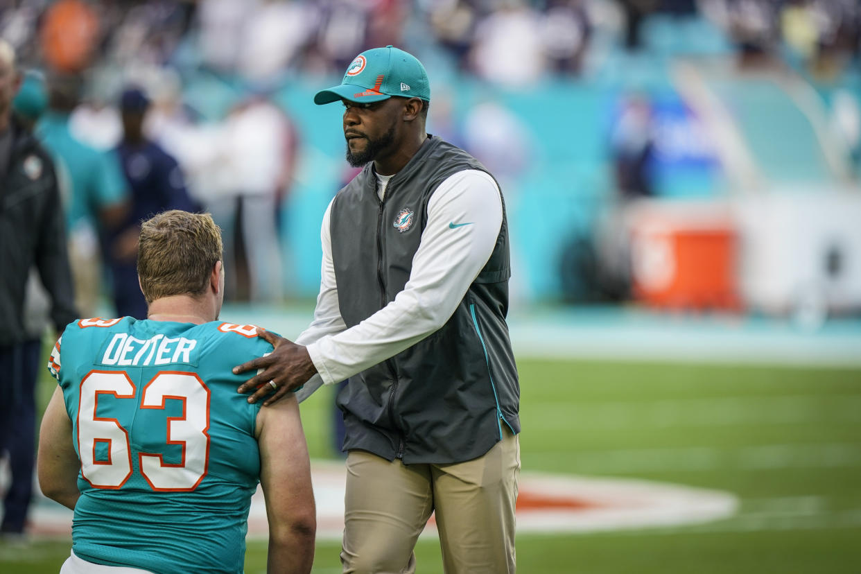 Former Miami Dolphins head coach <span class="caas-xray-inline-tooltip"><span class="caas-xray-inline caas-xray-entity caas-xray-pill rapid-nonanchor-lt" data-entity-id="Brian_Flores" data-ylk="cid:Brian_Flores;pos:1;elmt:wiki;sec:pill-inline-entity;elm:pill-inline-text;itc:1;cat:Coach;" tabindex="0" aria-haspopup="dialog"><a href="https://search.yahoo.com/search?p=Brian%20Flores" data-i13n="cid:Brian_Flores;pos:1;elmt:wiki;sec:pill-inline-entity;elm:pill-inline-text;itc:1;cat:Coach;" tabindex="-1" data-ylk="slk:Brian Flores;cid:Brian_Flores;pos:1;elmt:wiki;sec:pill-inline-entity;elm:pill-inline-text;itc:1;cat:Coach;" class="link ">Brian Flores</a></span></span> sued the NFL and three of its teams Tuesday, saying racist hiring practices by the league have left it racially segregated and managed like a plantation. (AP Photo/Willfredo Lee, File)