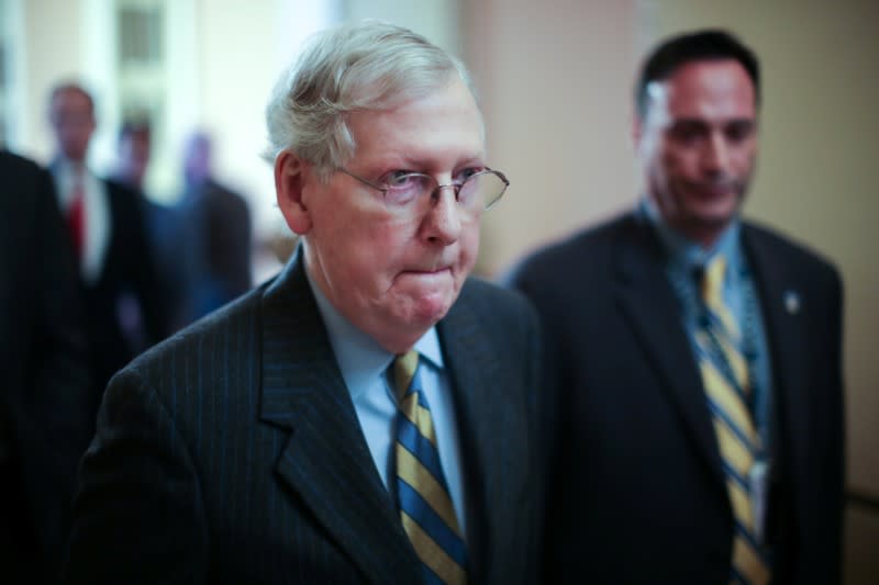 U.S. Senate Majority Leader McConnell returns to his office after the weekly Republican caucus luncheon at the U.S. Capitol in Washington