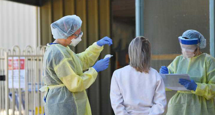 Hospital staff test people outside the Tanunda War Memorial Hospital.